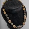 veneziane a lume Vetro lattimo trasparente. Perle nere a punti e oliva centrale nera forata (Venezia 1800).