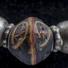 collana con vaghi tubolari in vetro millefiori - bauxite - vetro avvolto con decorazioni scritte. Argenti. 