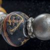 collana con vaghi tubolari in vetro millefiori - bauxite - vetro avvolto con decorazioni scritte. Argenti. 