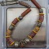collana con vaghi tubolari in vetro millefiori - bauxite - vetro avvolto con decorazioni scritte. Argenti. 