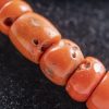 di coralli rossi cilindrici e argenti indiani dorati